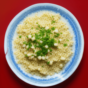 Transfer cooked pastina to a serving dish or individual bowls and toss gently.